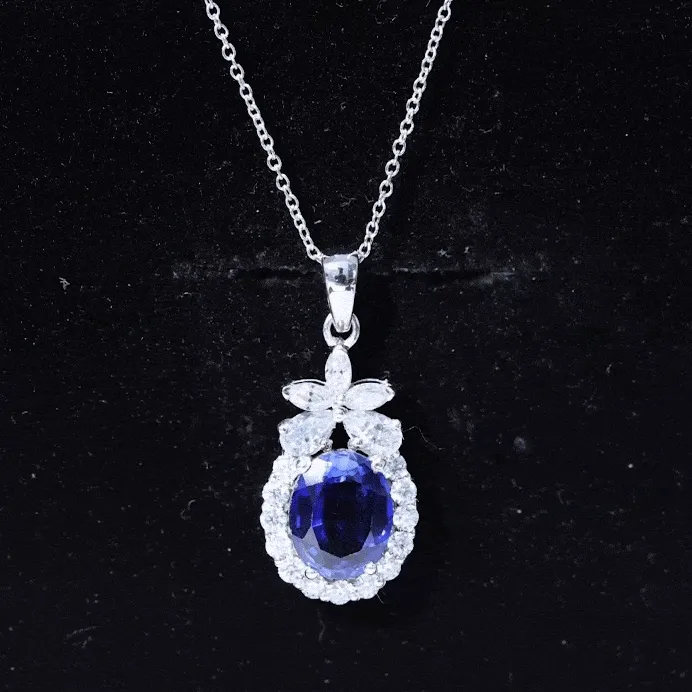 Oval Cut Created Blue Sapphire and Moissanite Floral Statement Pendant